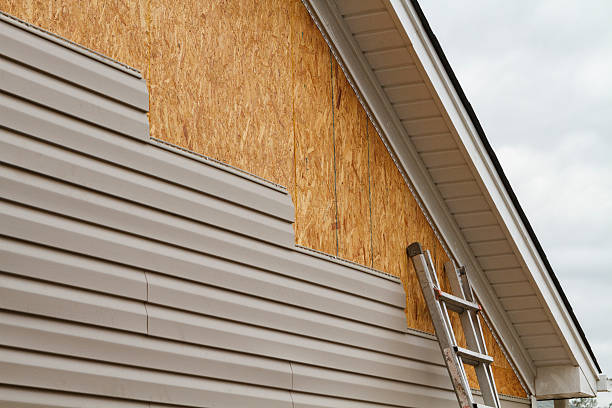 Professional Storm Damage Siding Repair technician working in Georgetown, IN